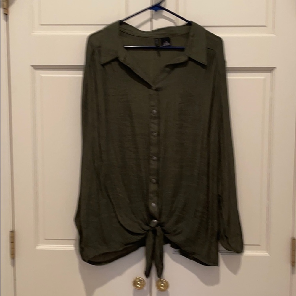 Long sleeve button up and tied at the bottom top.